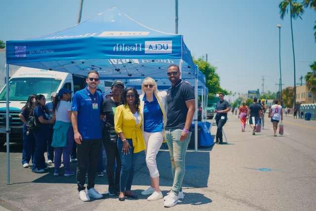 Mikel Whittier, from left, Becky Mancuso-Winding, Dr. Medell Briggs-Malonson, Shonda Peterson and Matthew Flesock were among those who represented 皇冠hga025大学洛杉矶分校健康 at the New Orleans Corridor ribbon-cutting. (Photo by Milo Mitchell)